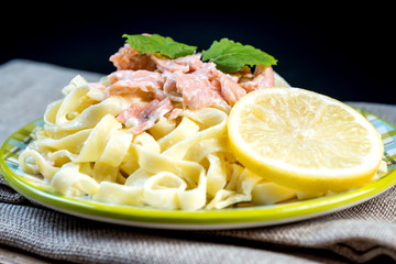 tasty pasta with salmon on a the table