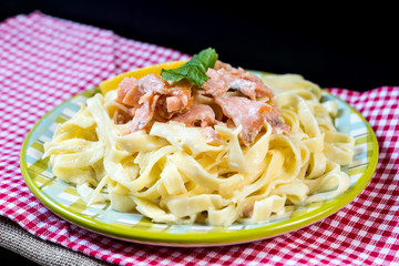 tasty pasta with salmon on a the table