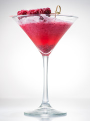 Cocktail clover club with raspberries on a light background