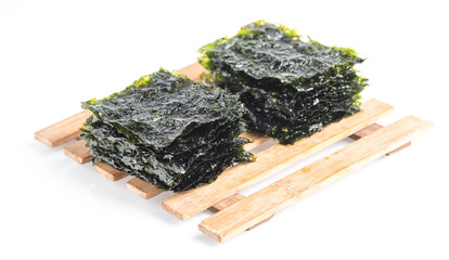 Japanese food nori dry seaweed sheets on white background © showcake