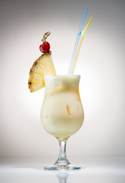 Cocktail pina colada with a piece of pineapple