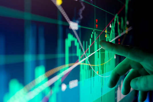 A city worker Analysing illustrated stock market financial  data on a screen.