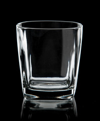 Empty glass for water on black background