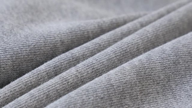 Gathers of cotton training piece of cloth 2160p 30fps UltraHD panning footage - Shallow DOF fine sweating shirt or pants fabric texture slow pan 4K 3840X2160 UHD video