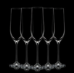 Silhouette of champagne glass on black background.
