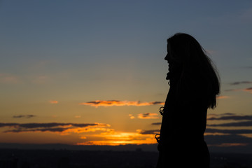 Silhouette of a woman during beautiful sunset.