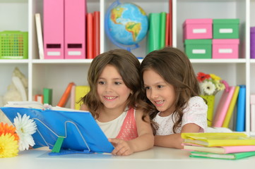 Fototapeta premium Two girls with their homework