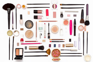 cosmetic makeup brush, nail Polish, face powder, eye shadow, lipstick, mascara, perfume, trimer and other accessories on a white background.