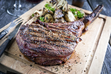 Barbecue Kobe Tomahawk Steak as close-up on Cutting Board