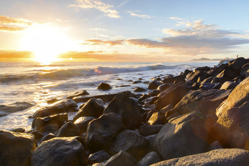 Burleigh Headland rocks and ocean tide at sunrise.