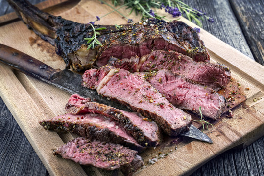 Barbecue Wagyu Tomahawk Steak as close-up on Cutting Board