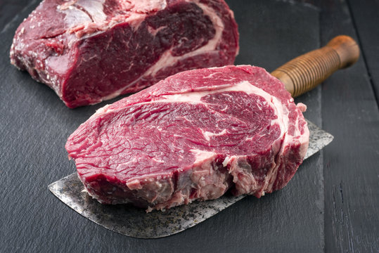 Dry Aged Kobe Entrecote Steak as close-up on Slate Slab