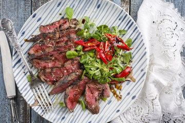 Barbecue Tagliata with Corn Salad and Chili on Plate © HLPhoto