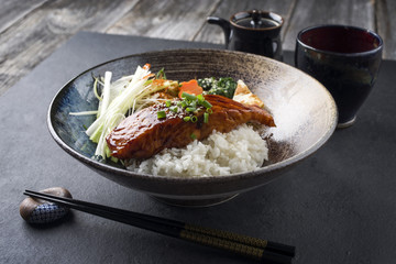 Traditional Japanese Salmon Teriyaki with Rice and Vegetable in a bowl