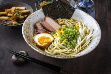 Traditional Japanese Ramen Yakibuta with Enoki and Egg as close-up in a bowl