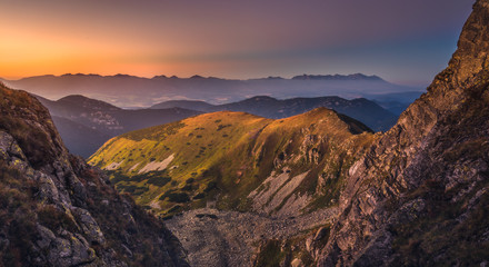 Fototapeta na wymiar Mountain Landscape in Colourful Sunset. View from Mount Dumbier in Low Tatras, Slovakia. West and High Tatras Mountains in Background.