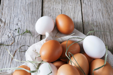 Fresh chicken brown eggs on rustic wood, organic farming concept