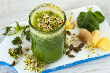 Homemade green smoothie with pineapple, spinach, nettle and ginger