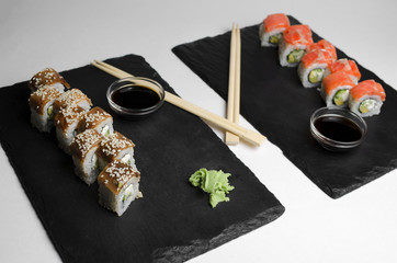 Mix  sushi with eel on slate plate