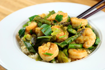 A bowl of freshly made shrimp and asparagus stir-fry
