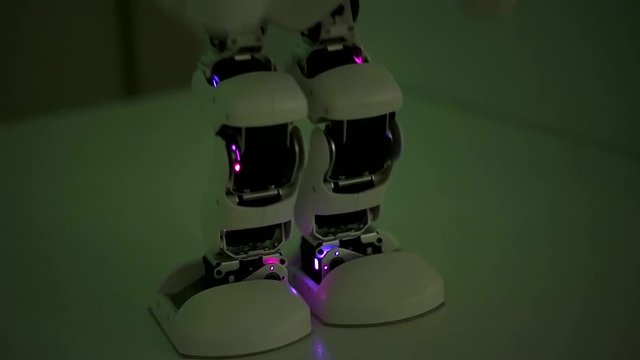 The Robot dances close up.