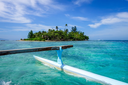 Pirogue on the way to paradise tropical atoll in Moorea Island lagoon