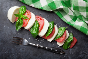 Caprese salad. Mozzarella, tomatoes and basil