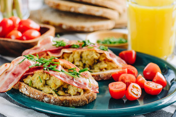 Sandwiches with scrambled eggs and bacon