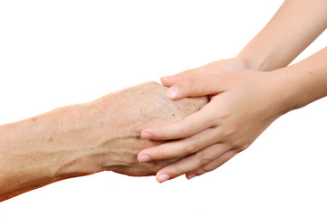Fototapeta premium child holding senior old woman by the hands isolated in the white background. Two generation make a care each other.