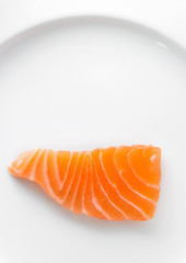 salmon sliced on a white plate