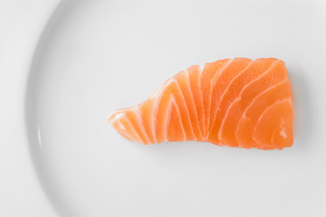 salmon sliced on a white plate