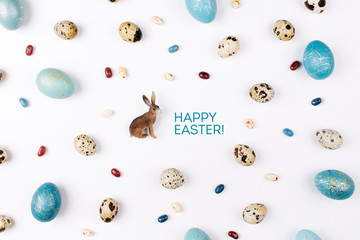 Happy Ester card. Easter bunny on white background decoration quail, gold and blue easter eggs....