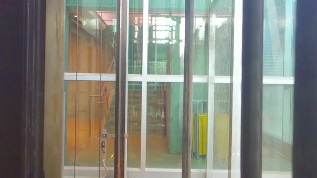 transparent glass elevator in the modern building