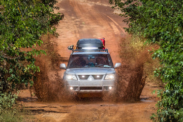 Obraz na płótnie Canvas JALAPAO, BRAZIL - JANUARY 2017 - A mud splash of an offroad vehicle on january 5th, 2017. Tourist driving at Jalapao State Park, Tocantins, Brazil.