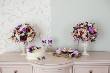Wedding decorations. Bouquets of flowers and cake