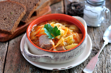 Soup of beef ribs, sauerkraut, onions, carrots and parsley.