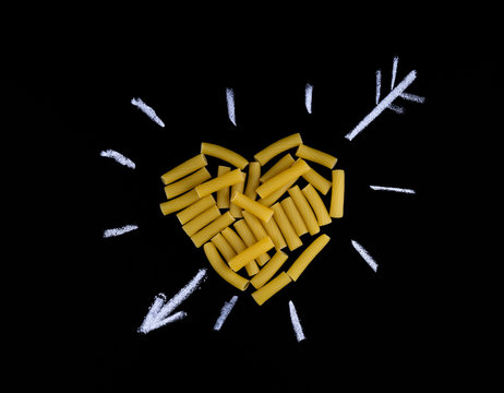 Heart shape made of pasta tortiglioni. Pasta in the shape of a h