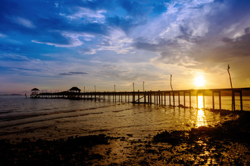 Obraz premium Wooded bridge to the sea between sunset at Koh Kood, Trat, Thailand
