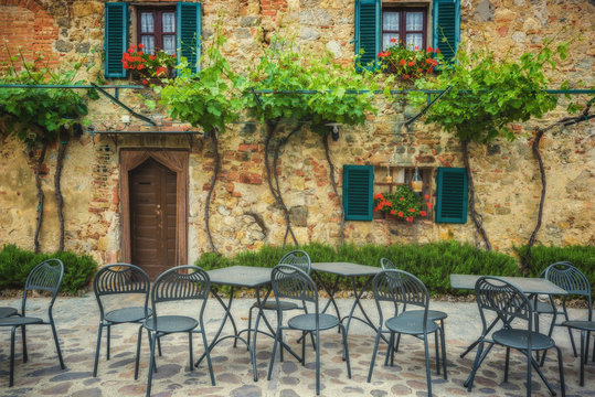 outside a quaint stone building in Tuscany, Italy