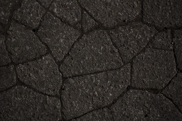 Obraz premium Macro closeup on concrete asphalt cracks on the road