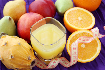weight loss, diet concept: various fruits with glass of freshly squeezed juice