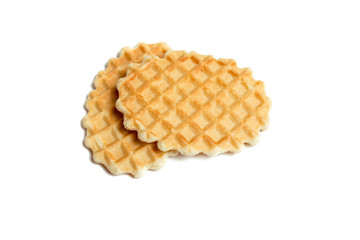 Two golden round waffles isolated over white background.