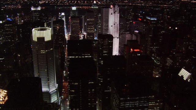 Night flight over midtown Manhattan skyscrapers. Shot in 2005.