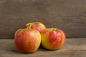 Healthy apples on wooden background