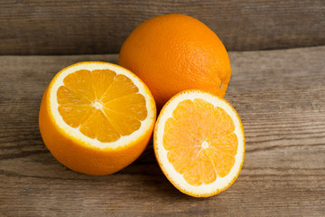 Sliced oranges on wooden background