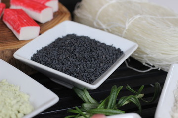 preparing sushi, making sushi, preparing japanese food, making japanese food, ginger, red ginger, sesame, black sesame, chopsticks, wasabi, rice, special rice, special rice for sushi, surimi, 