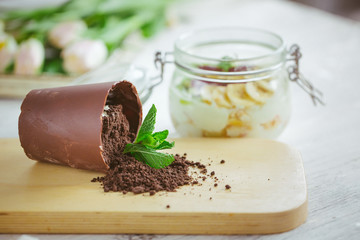 Chocolate dessert in the form of a fallen flower pot