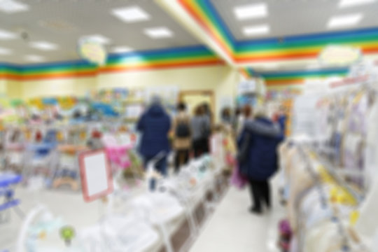 Blurred background image of supermarket or shopping mall.