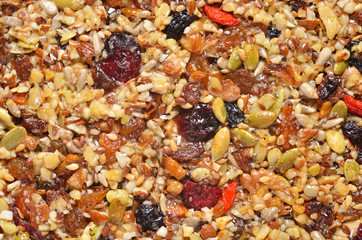 Homemade paleo granola on baking sheet. Breakfast food background.