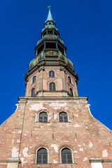 Fototapeta premium Tower of Lutheran church of St Peter, Old City of Riga, Latvia